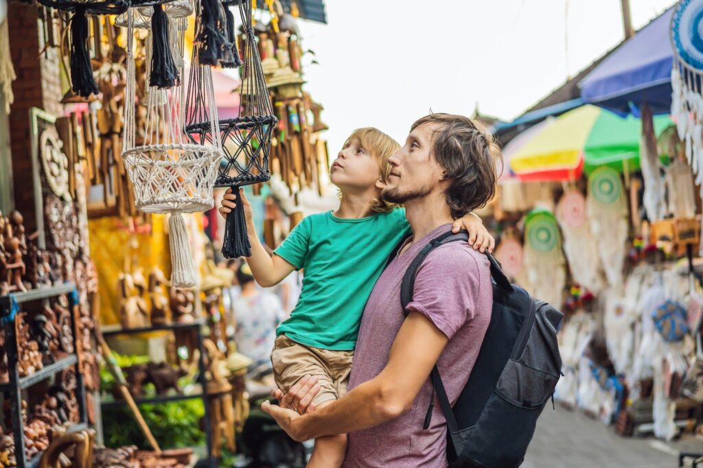 Father and son browsing markets