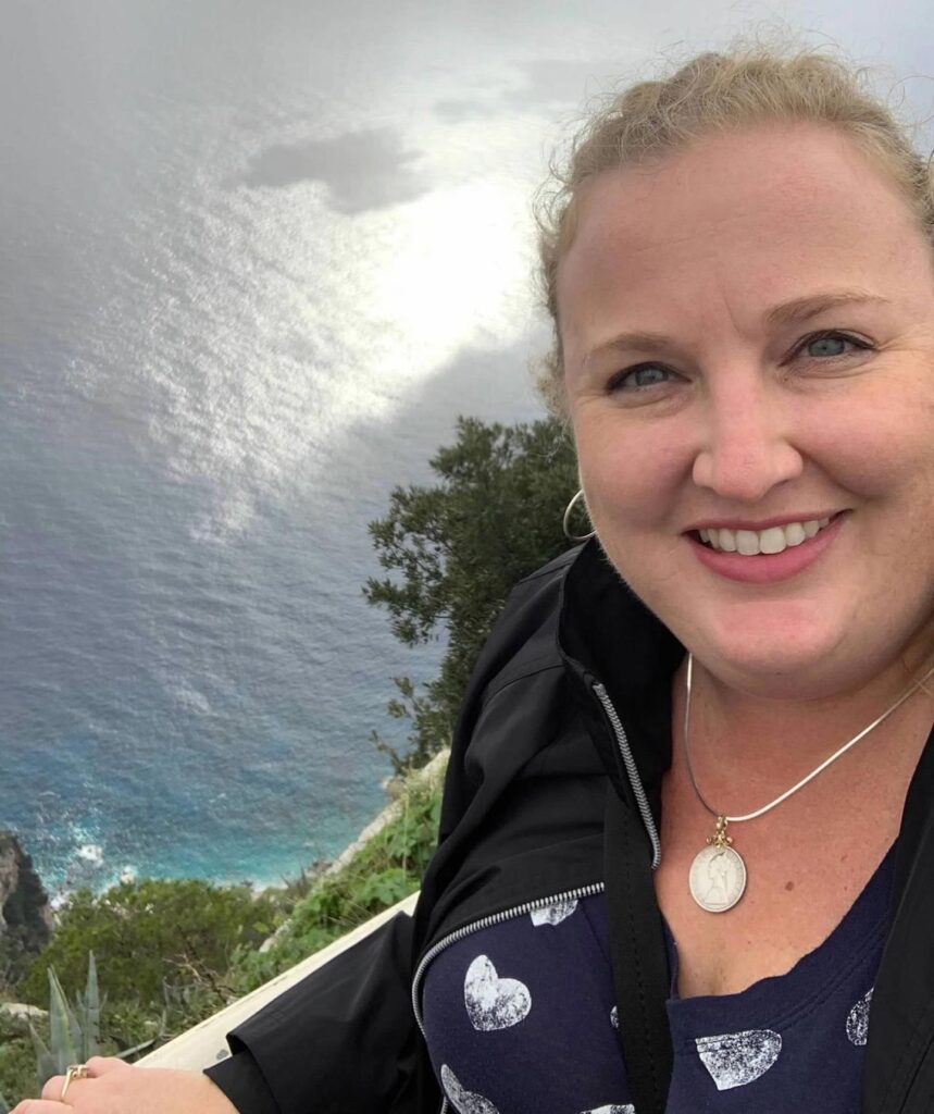 Trafalgar past guest JEssica in italy with her lira pendant