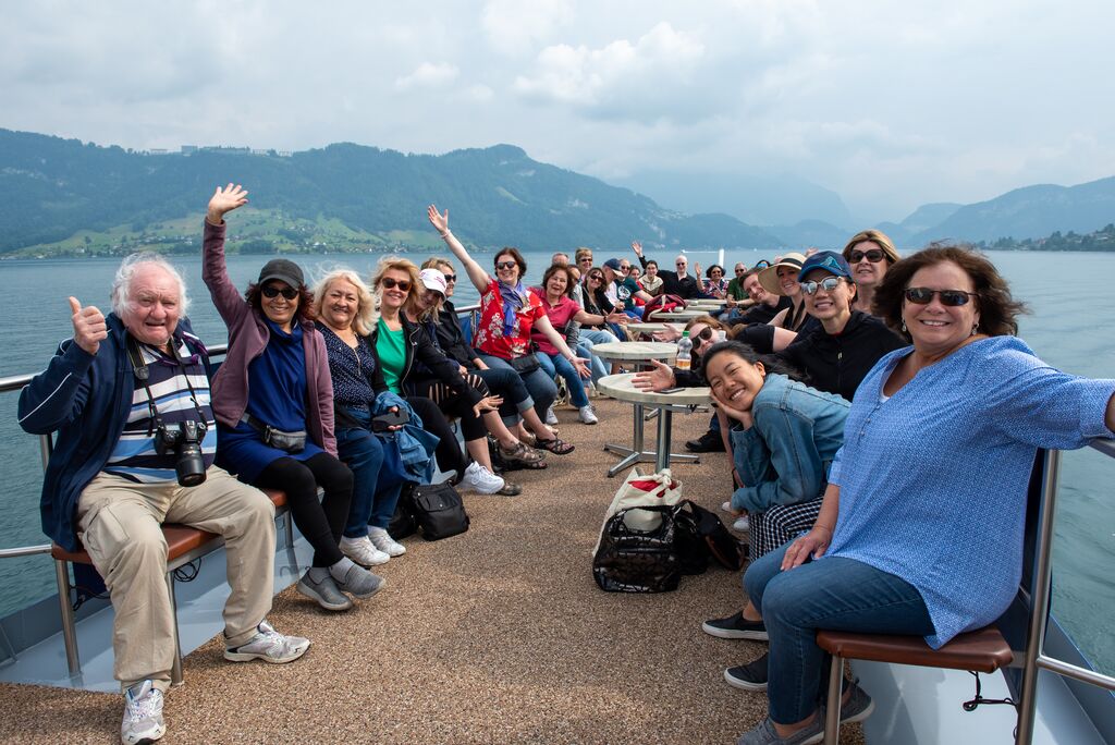 Group photo of Trafalgar guests on a lake cruise in Switzerland