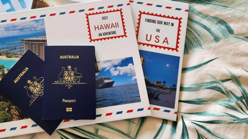 Two Australian passports with a travel itinerary for Hawaii and the United States