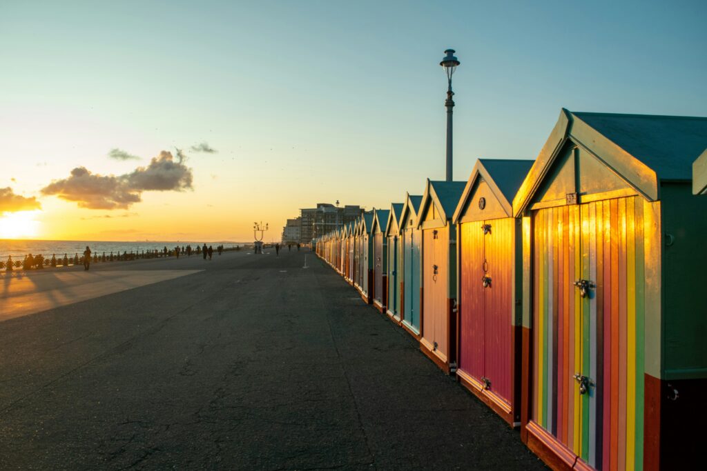 Colourful beach huts lining the coast of Brighton, England.