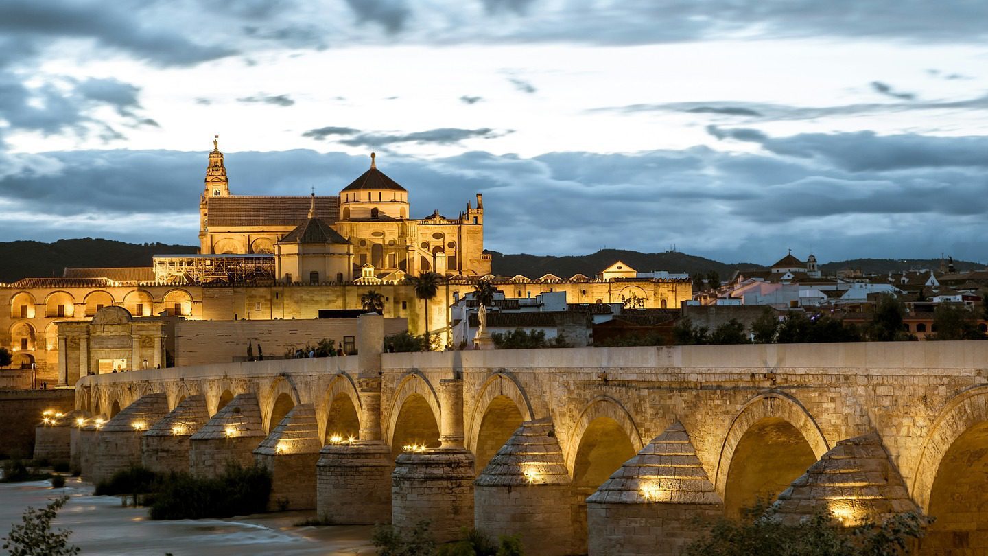 bridge lit up at night Cordoba Spain
