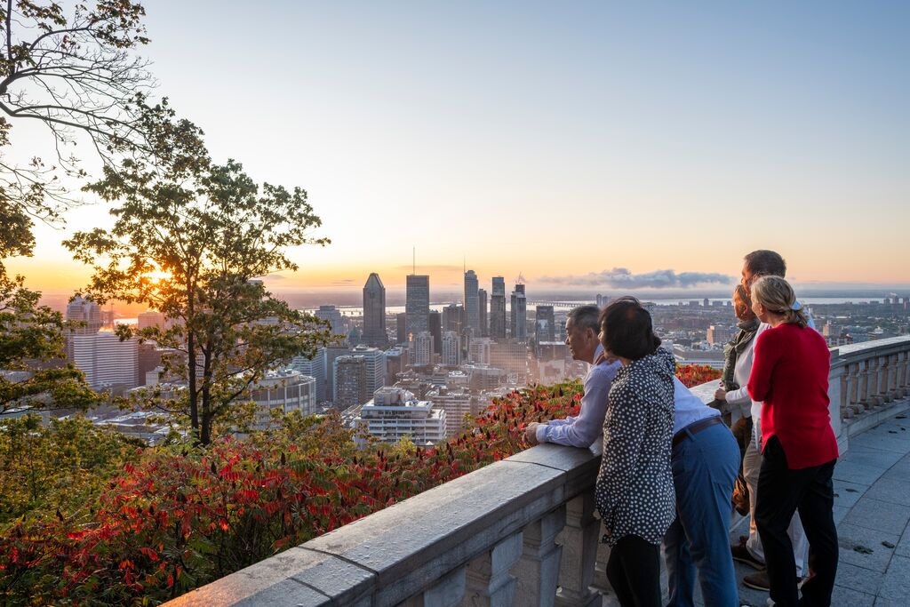 Guests look over the skyline of Montreal, Quebec