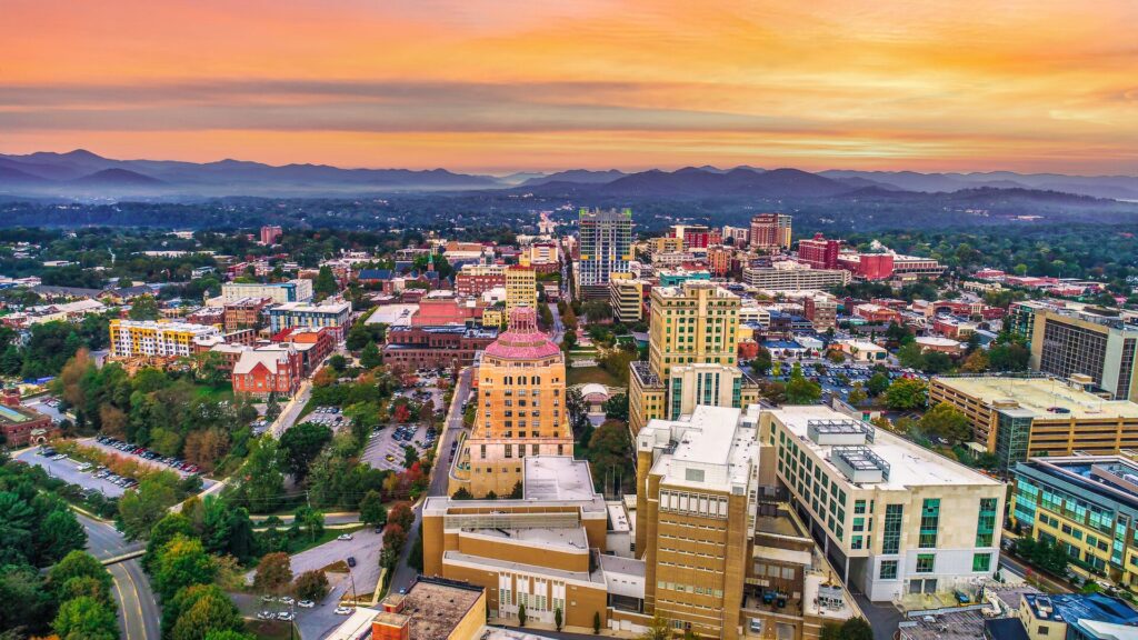 City skyline with mountains andh ills in the back - North Carolina