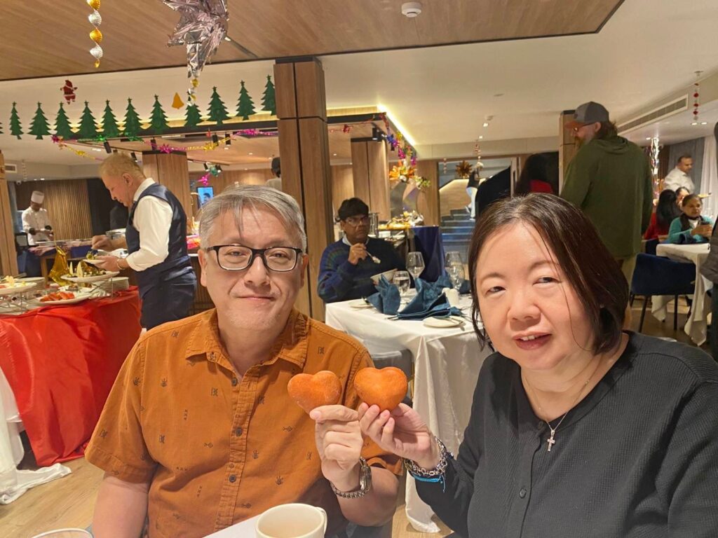 Sharon Yu and her husband in a restaurant