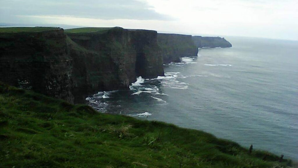 Cliffs of Moher in Ireland, with waves crashing against them