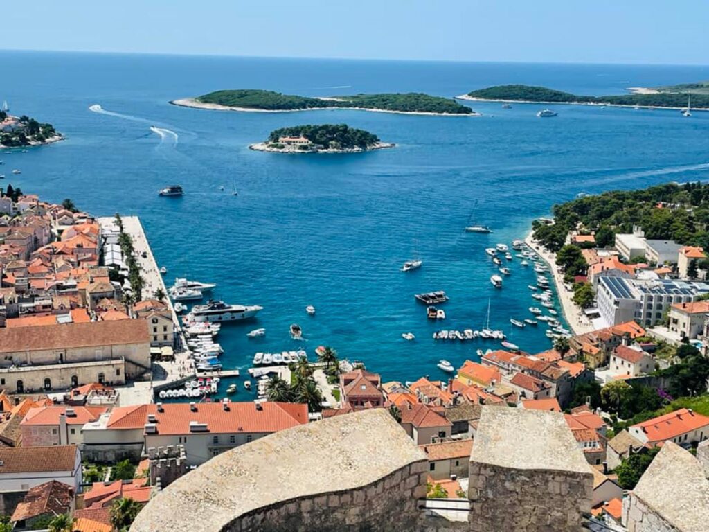 The pale blue Adriatic by Hvar, dotted by islands and islets and sailing boats