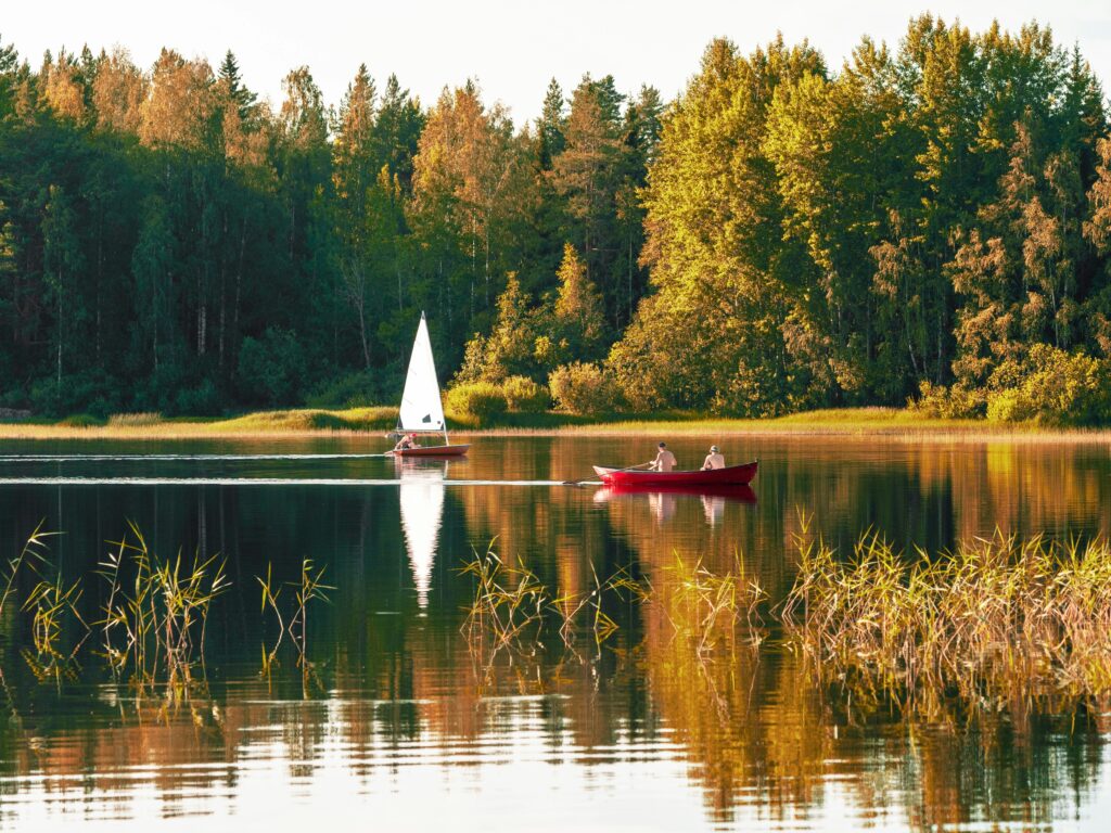 People sailing on lake in Finland