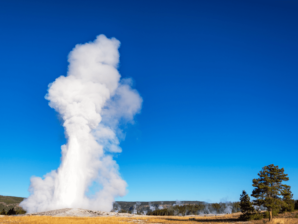 Old Faithful Geyser erupting: one of the best things to do in Yellowstone National Park