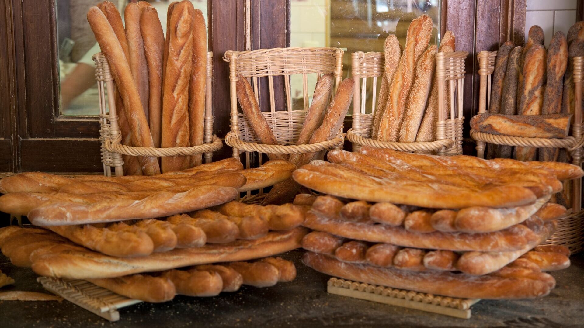 Fresh baguettes displayed at a Parisian bakery