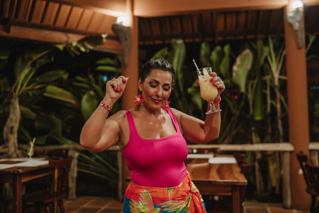 Josephine dances with a cocktail