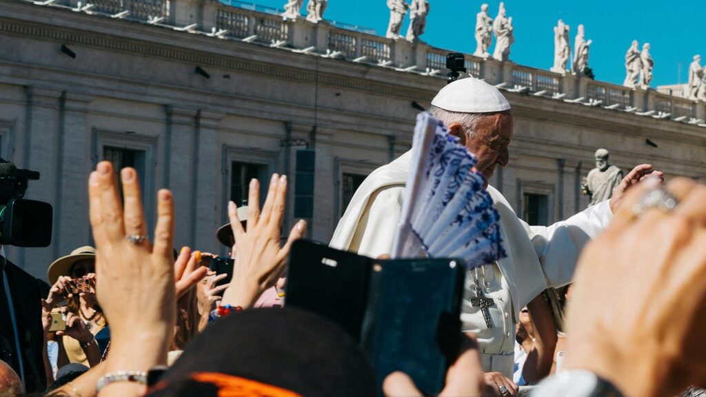 The pope waving to a crowd