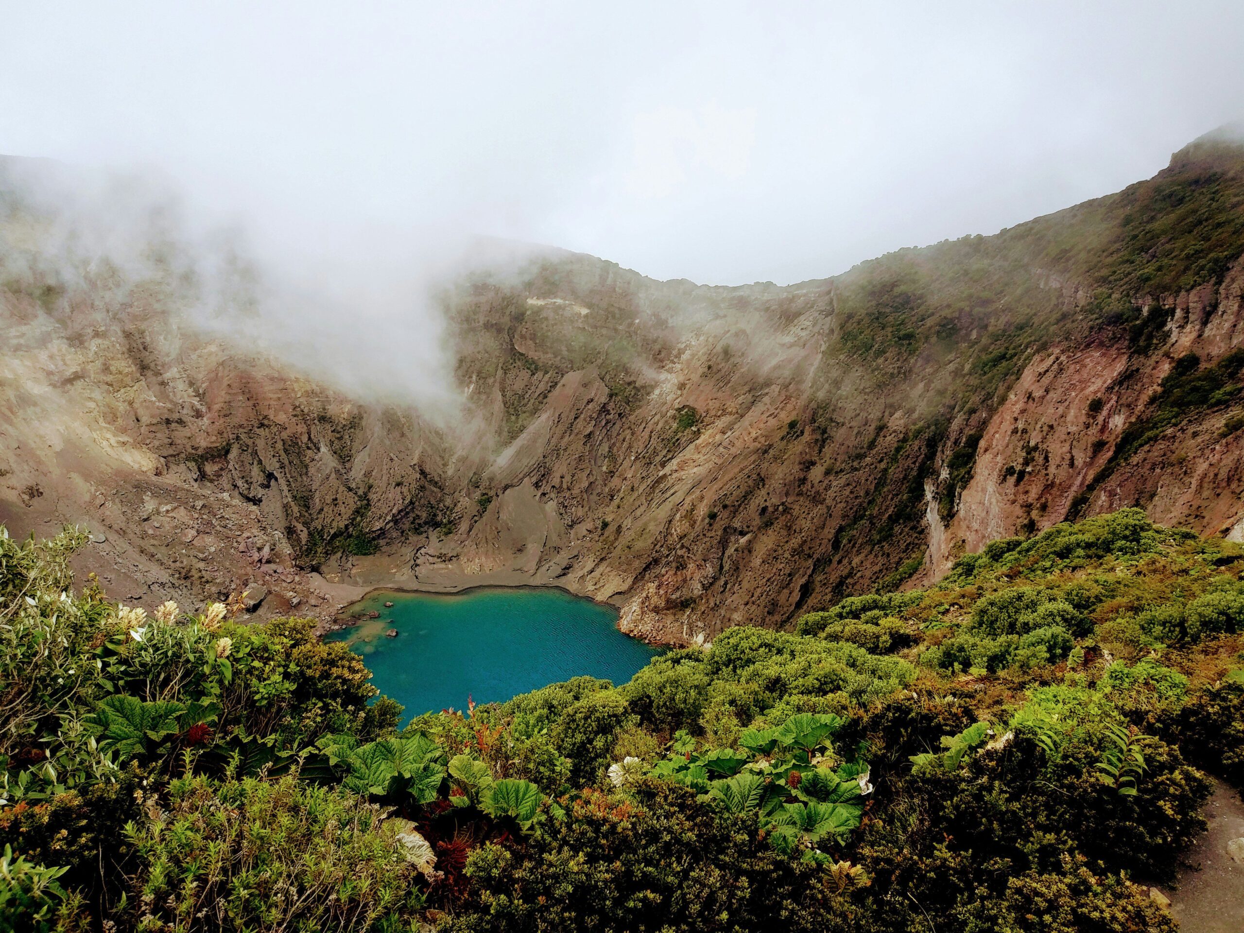 Lagoon surrounded by cliffs and vegetation