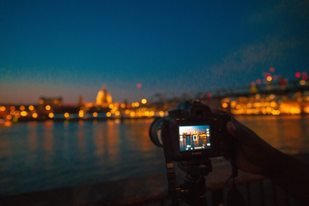 camera taking photo of london at night