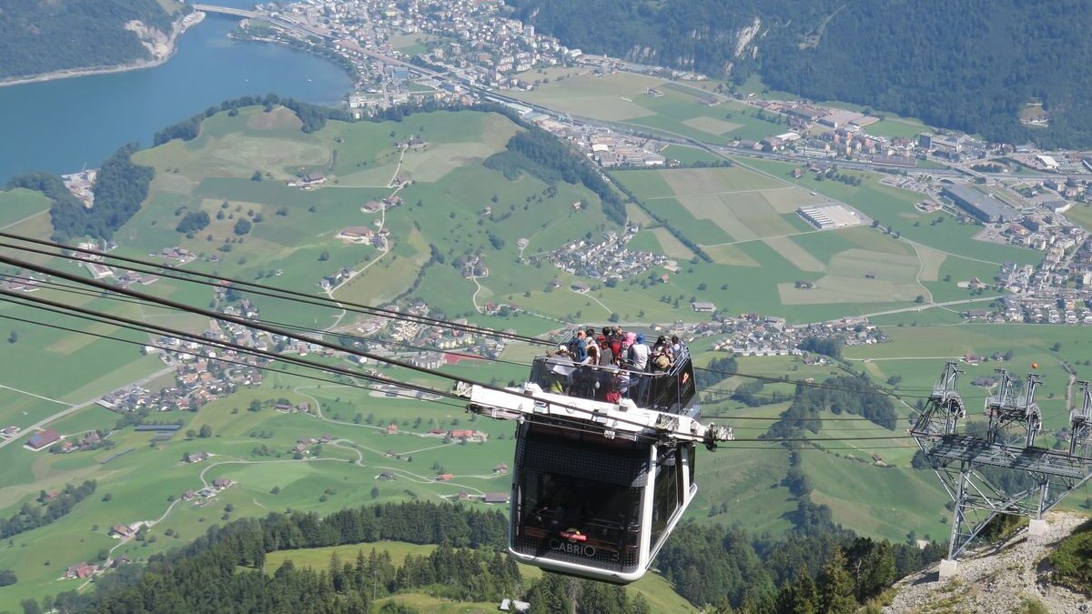 The Cabrio open-air cable car gliding over scenic lake views in Lucerne Switzerland