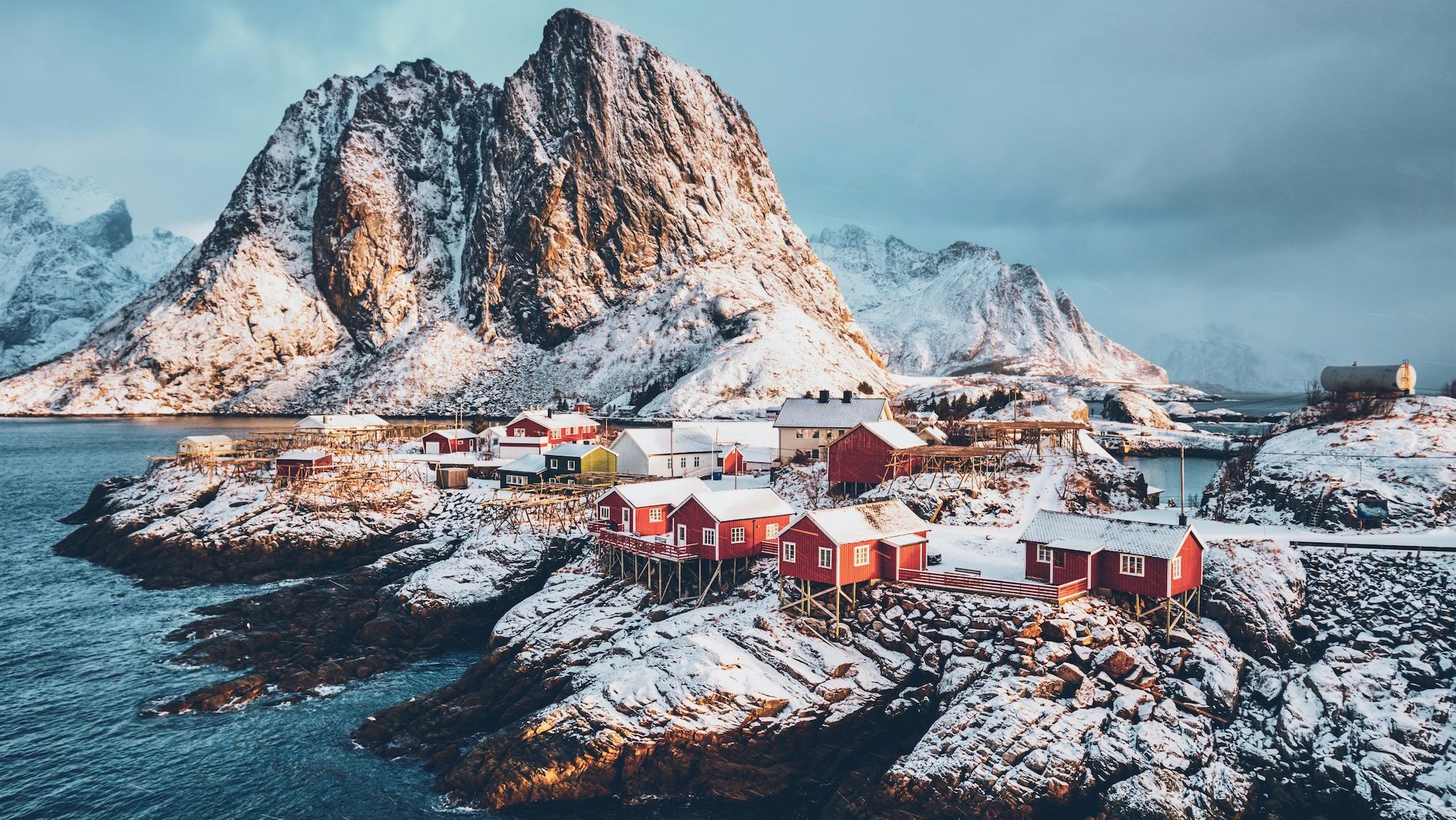 view of red houses in the snow, norway