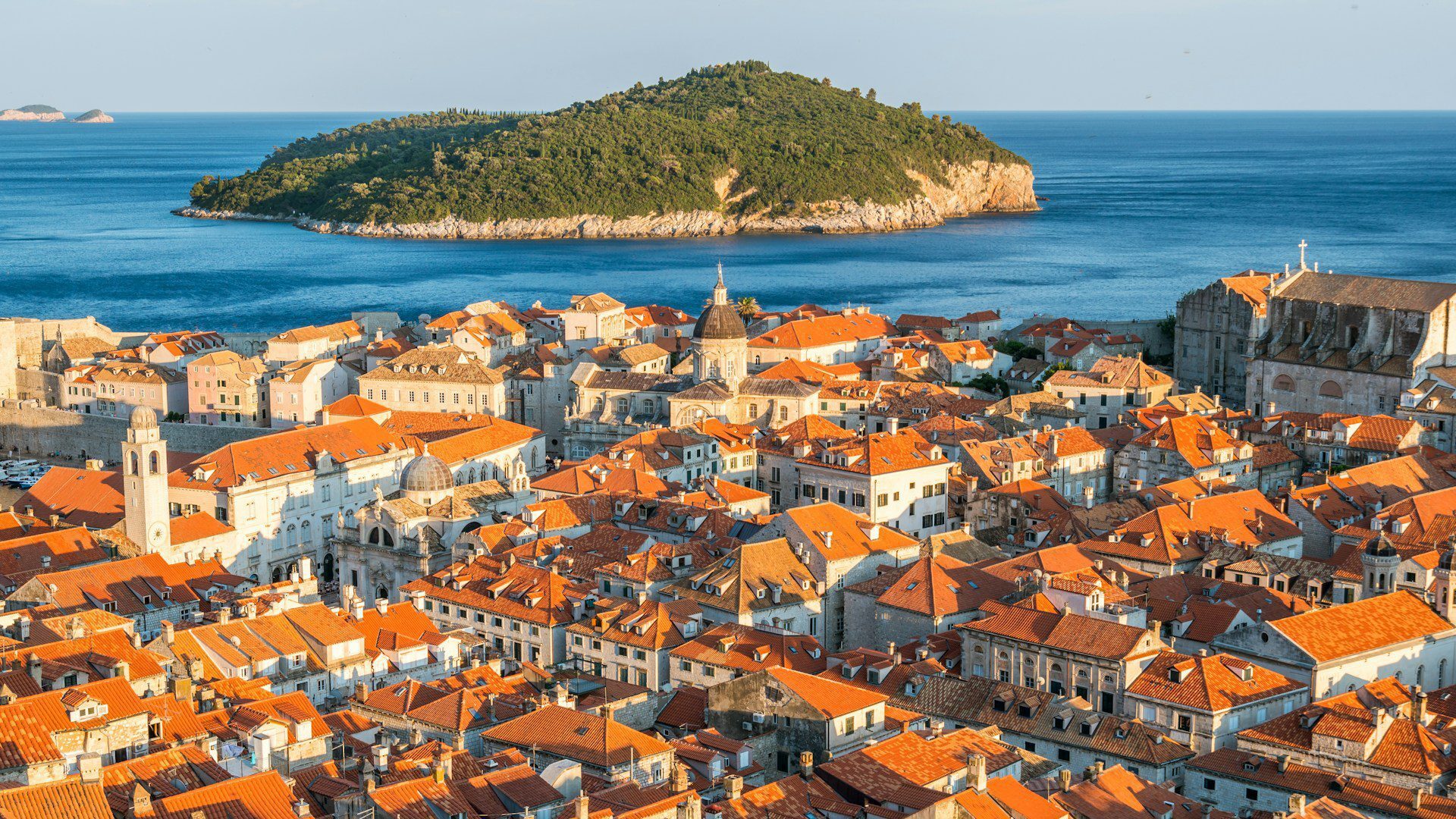 View over the terracotta rooftops of Dubrovnik looking towards the island of Lokrum