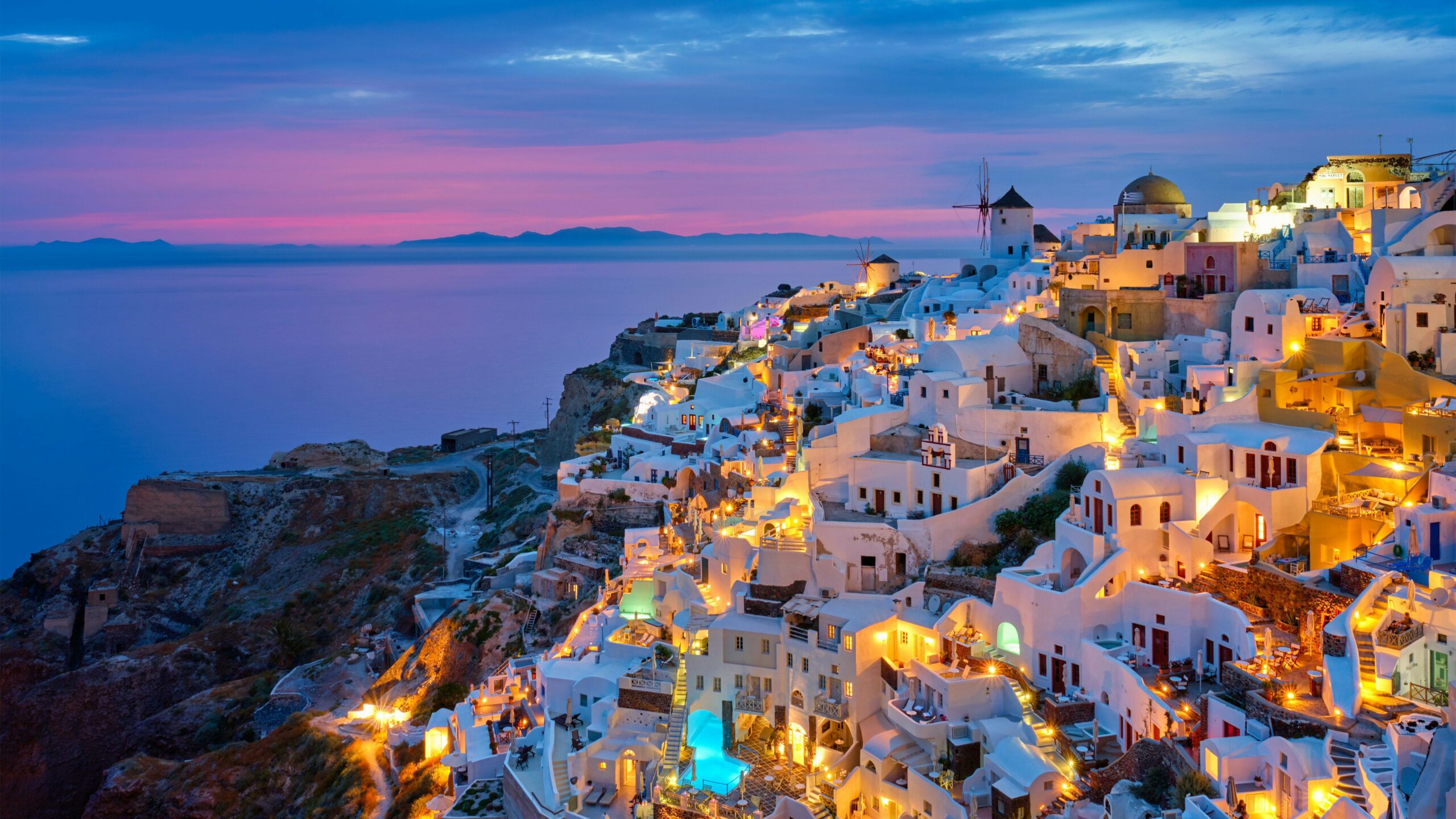 white buildings in mykonos at sunset