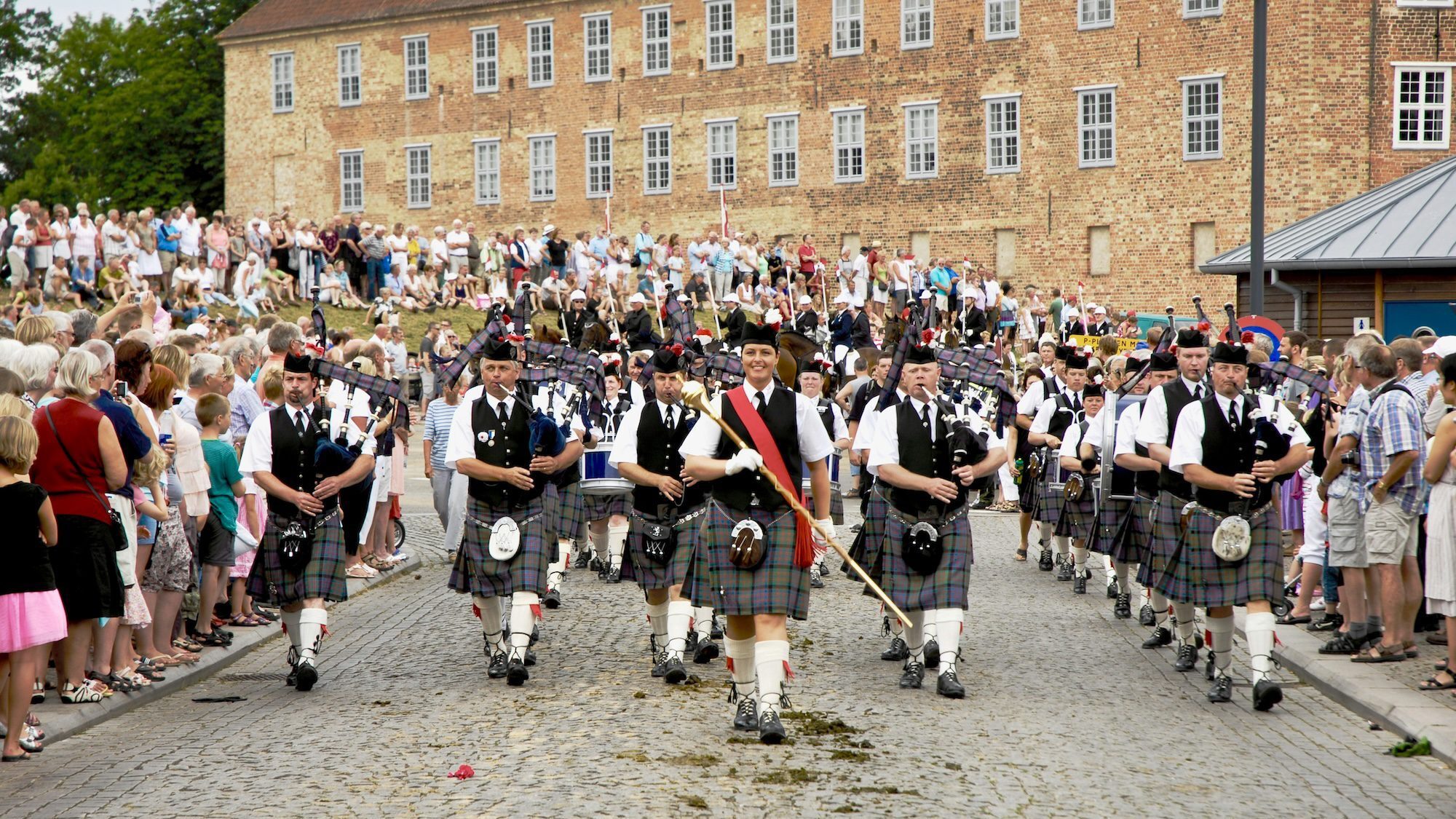 marching band playing bagpipes in scotland