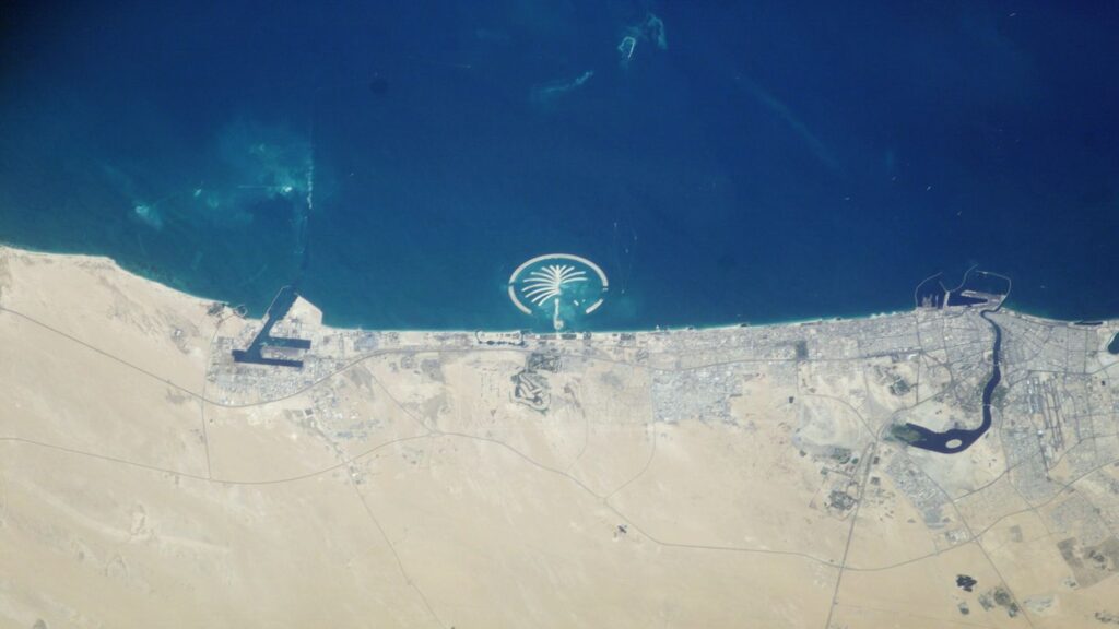 An aerial view of the palm tree in Dubai, United Arab Emirates, seen from space.