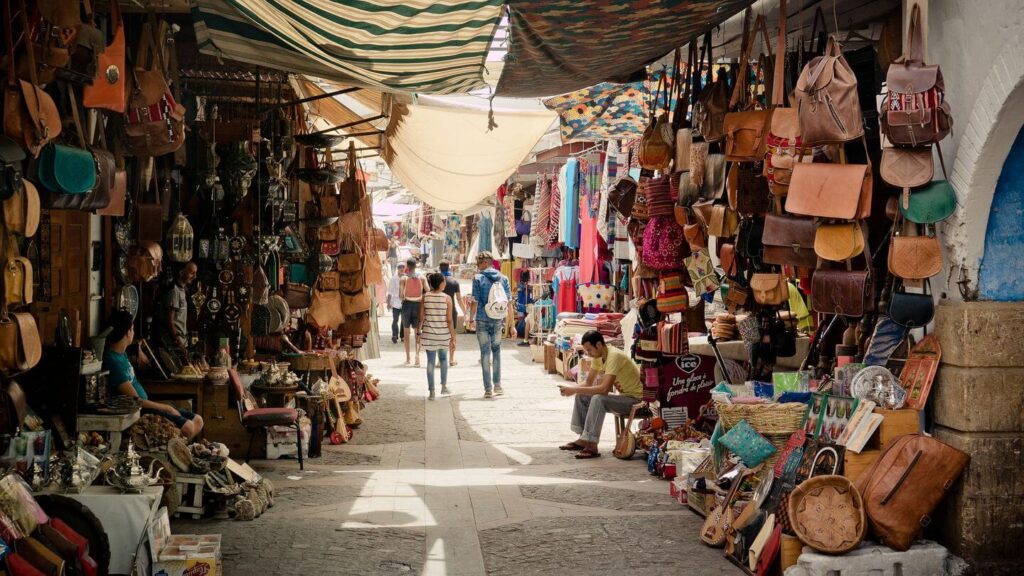 For Morocco travel tips, venture down a narrow alley lined with bags and purses.
