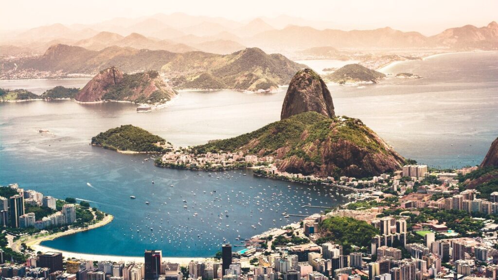 Aerial view of Rio de Janeiro with Sugarloaf Mountain and surrounding cityscape, captured during travel in 2021.
