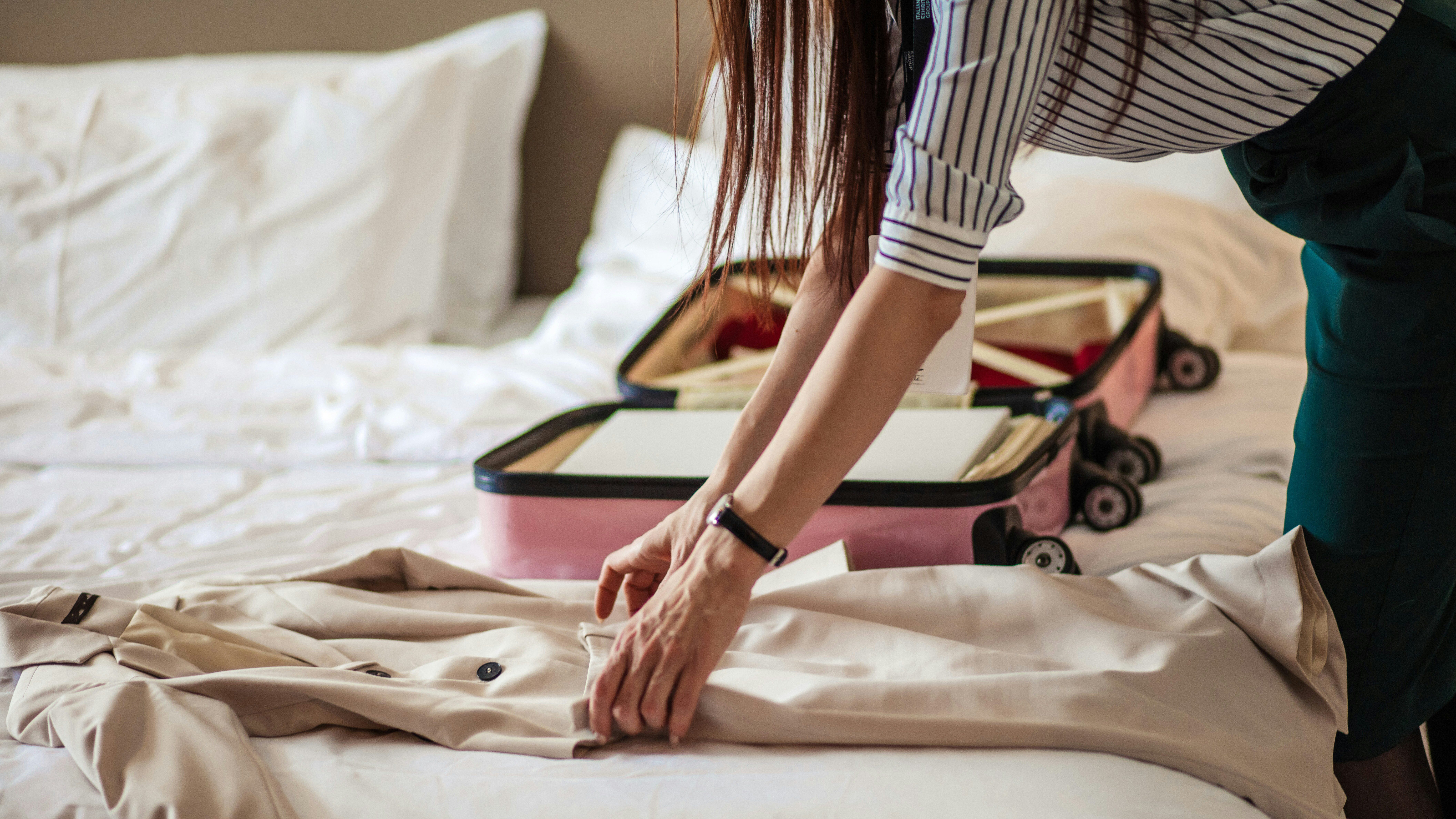 woman packing for her europe trip