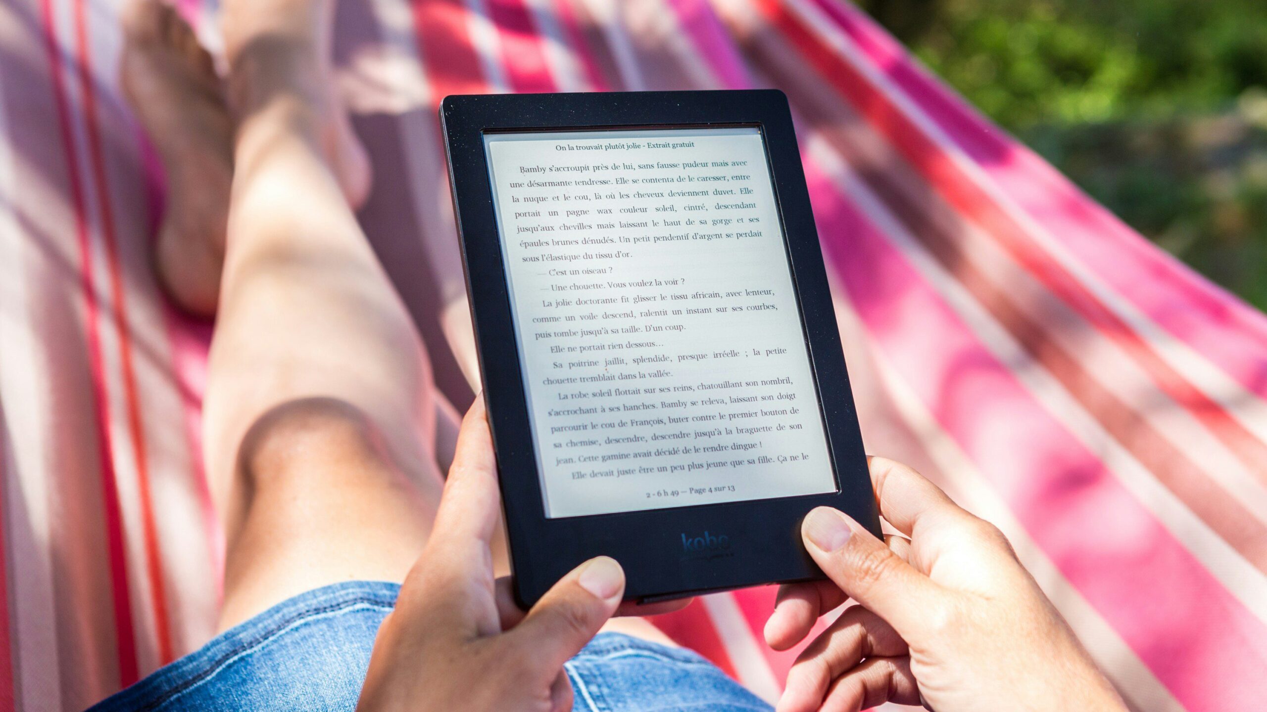 person reading an e-book, one of the europe packing essentials