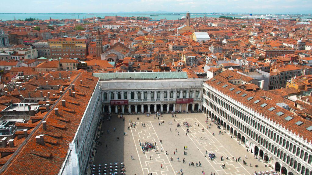 Aerial view of Venice, looking down on St Mark's Square and red tiled rooftops of the city
