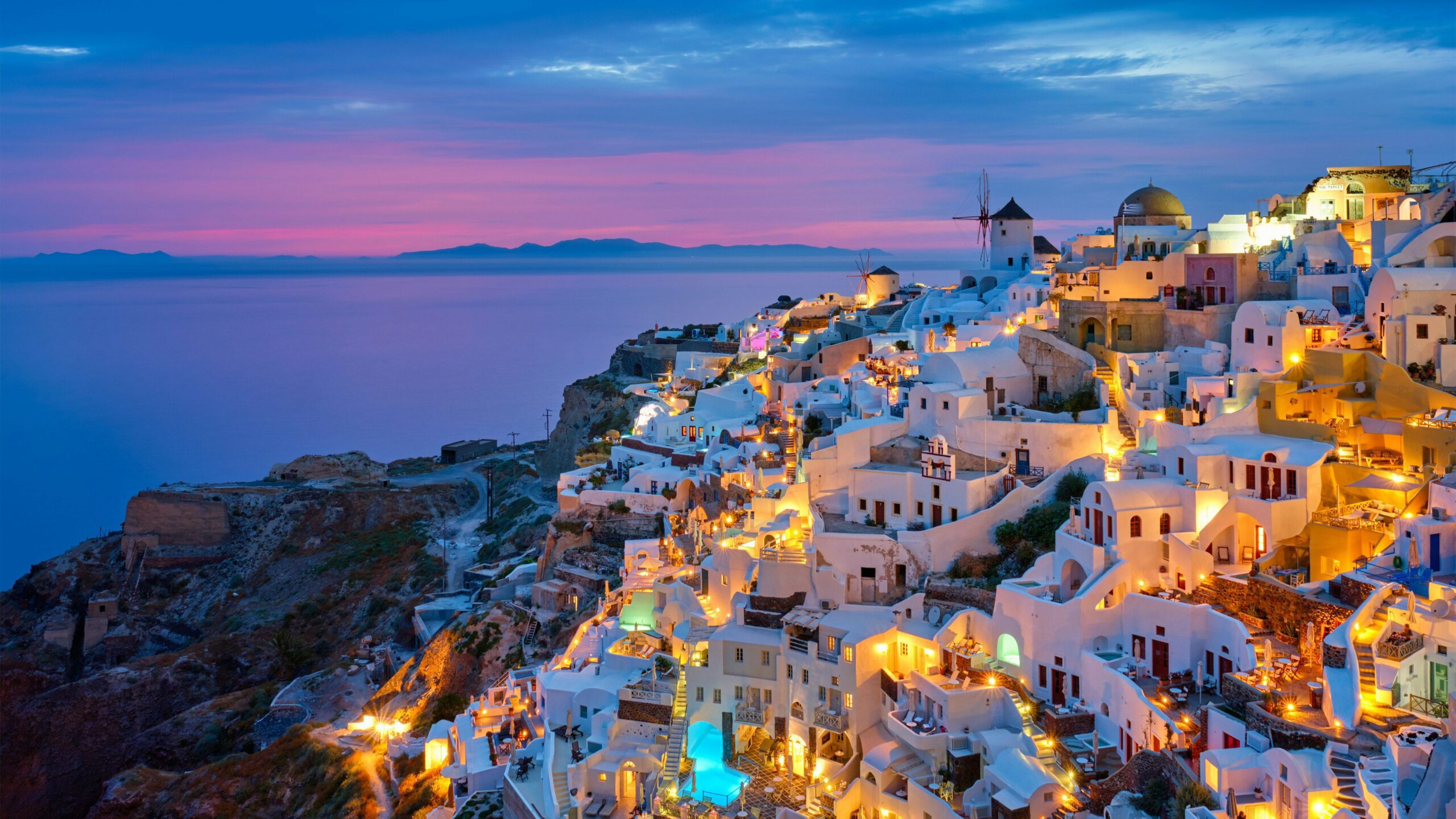 santorini hill and sea view at sunset