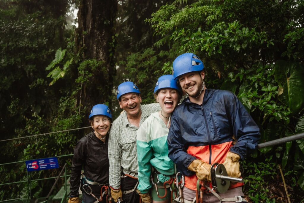 group of people ready to zipline with helmets on