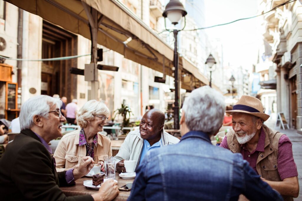 group drinking coffee in street