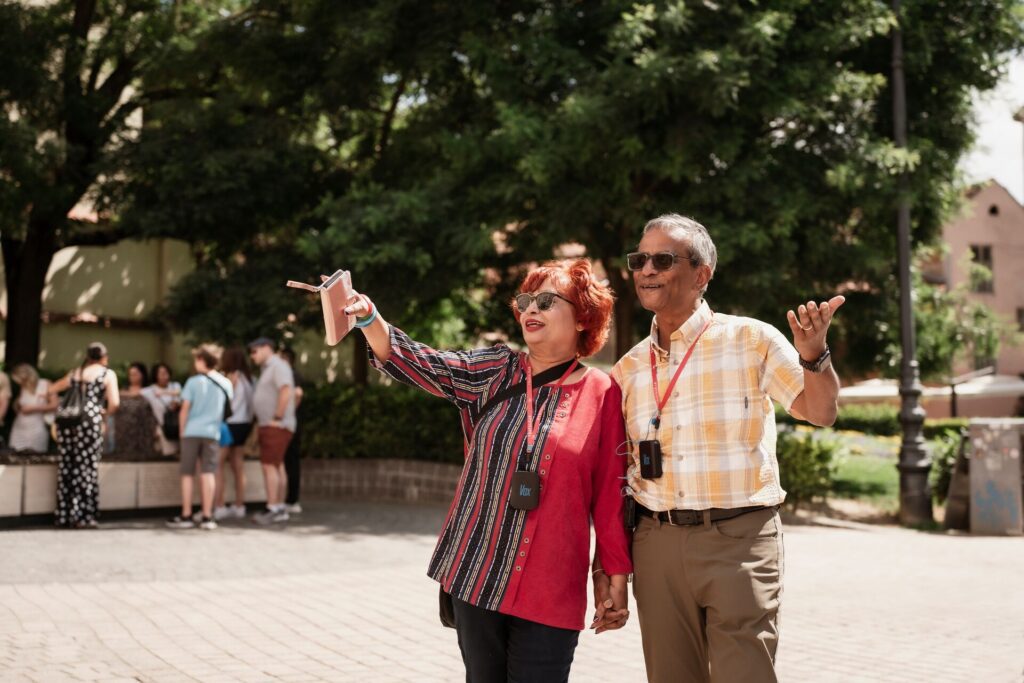 man and woman with sunglasses on pointing