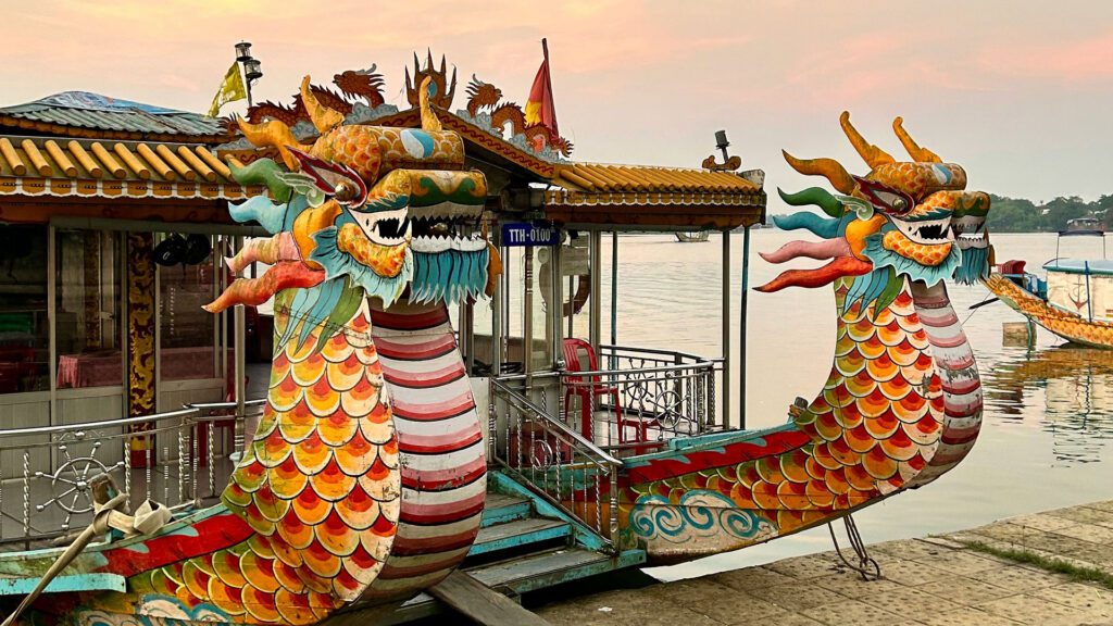 River ferry boat decorated with traditional dragon-styled floats