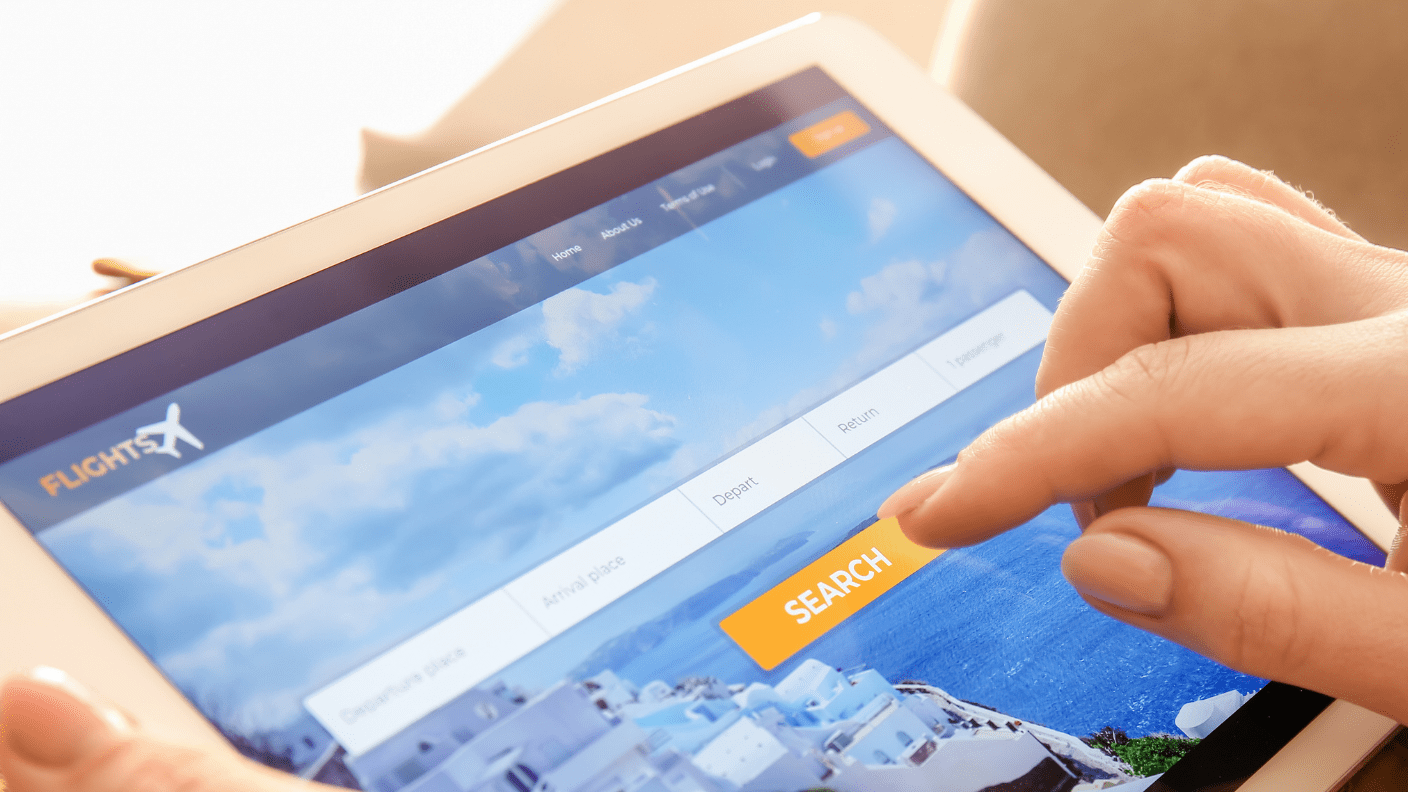 someone on ipad booking flights