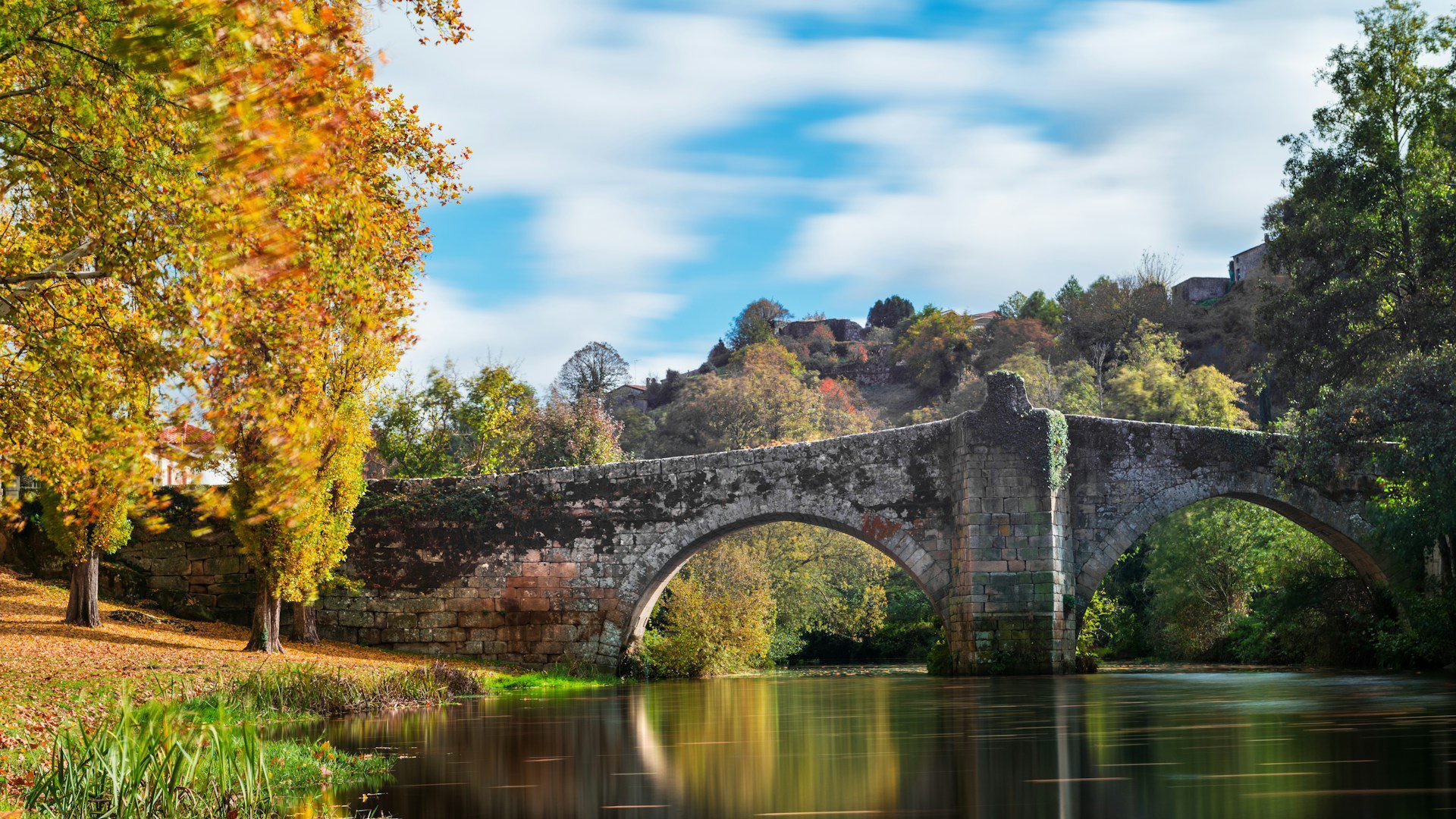 Old stone bridge over a river