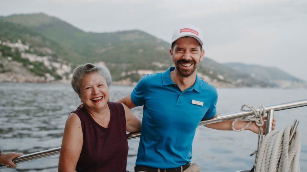 Tod standing arm-in-arm with a Trafalgar guest