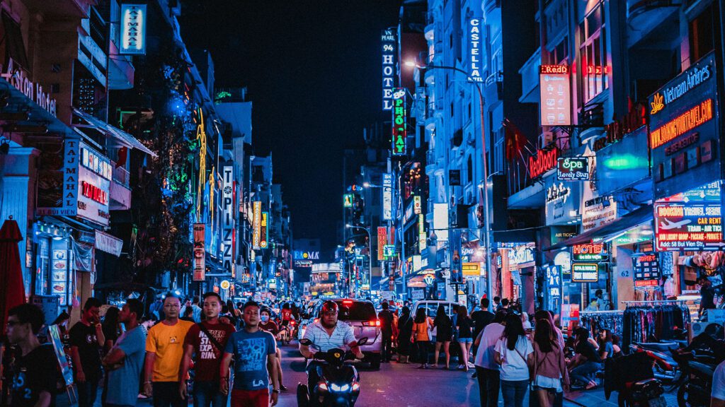 Neon signs line a main street in Ho Chi Minh City