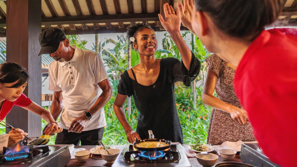 Avery giving a high-five to cookery teacher