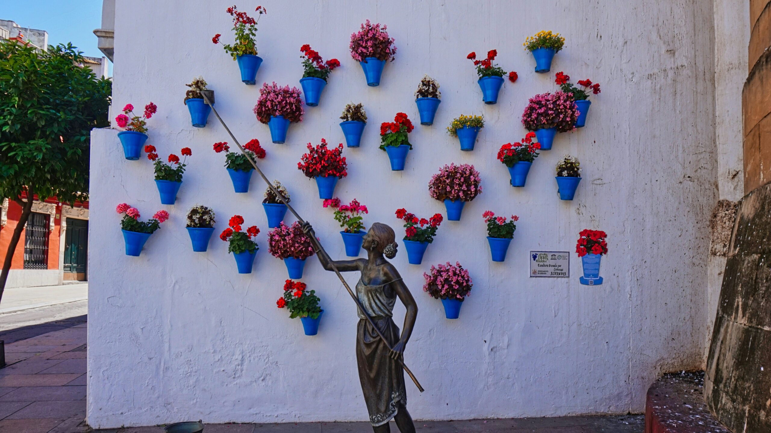 A monument of a woman who waters the plants in Córdoba in Spain