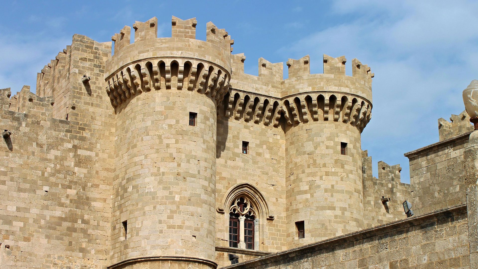 Castle with turrets set against a blue sky