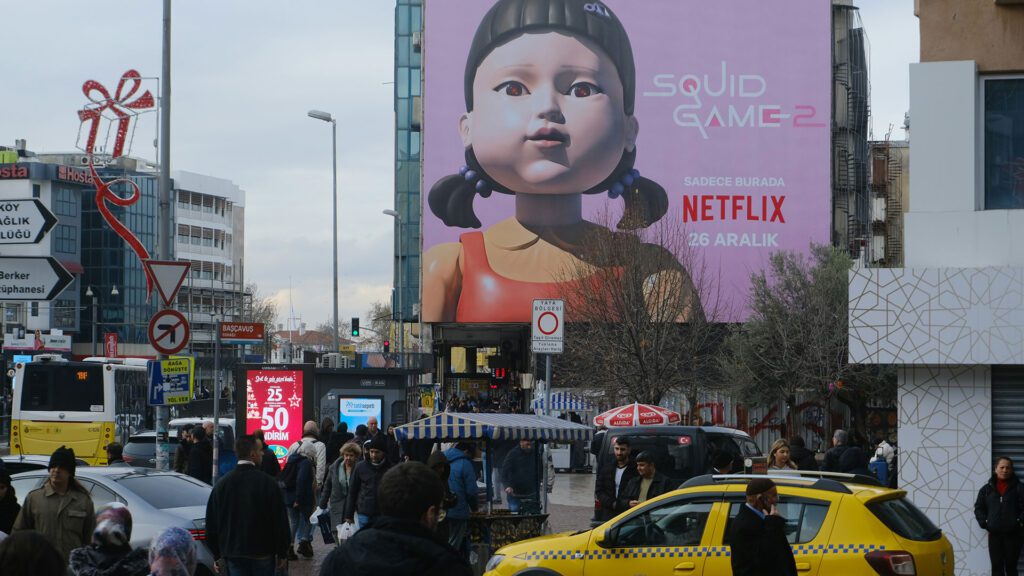 Billboard of Squid Game 2 in a city