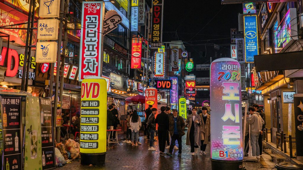 Neon signs on street at night in Seoul