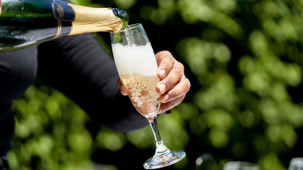 pouring a glass of champagne