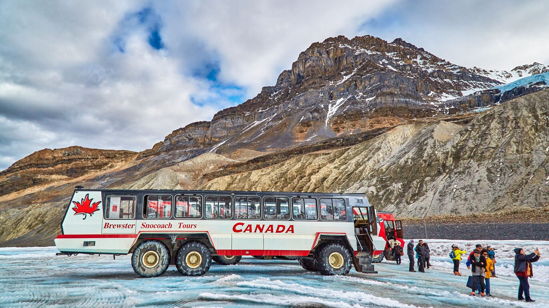 people walking onto glacier in canada