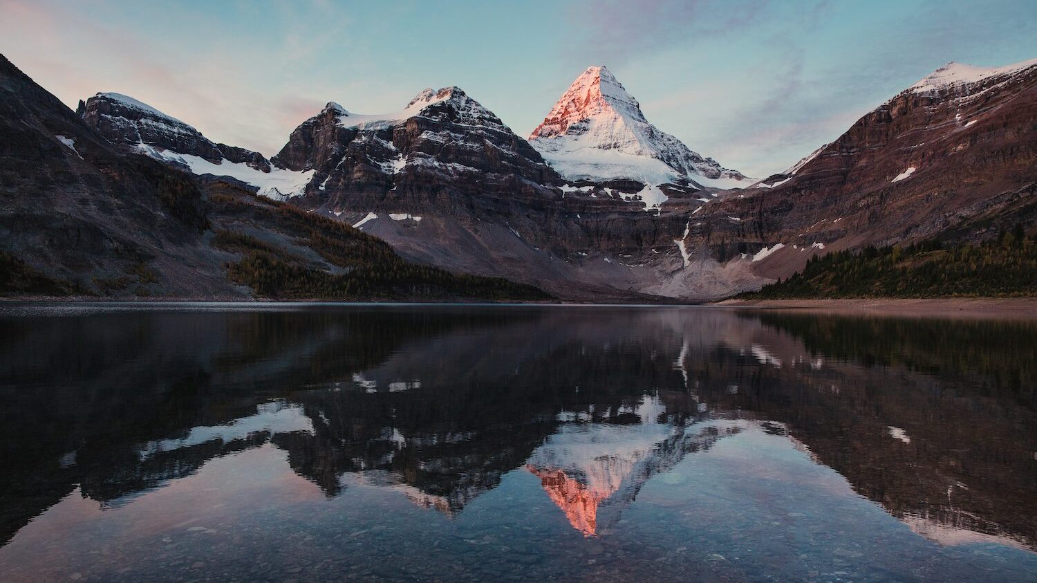 rocky mountains and lake at sunset