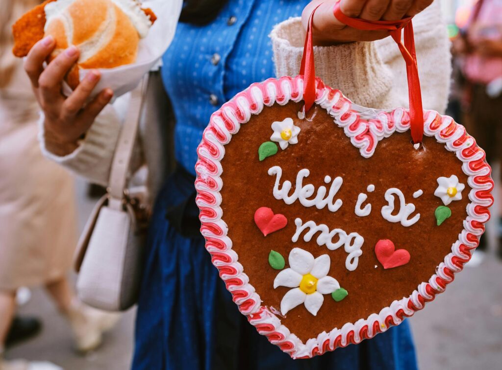 A schnitzel sandwich and large gingerbread heart at Oktoberfest in Munich, Germany