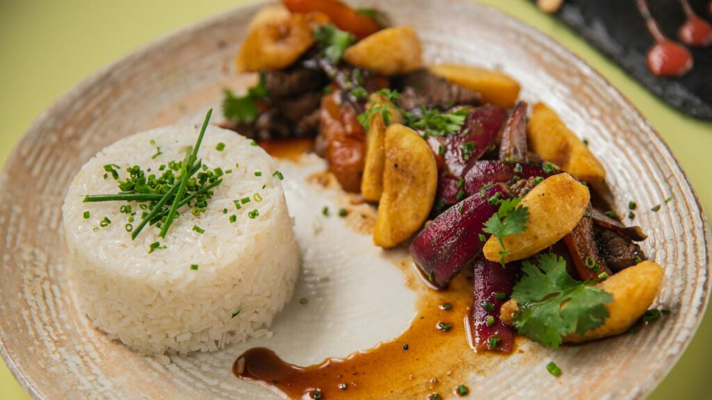 Smoky Lomo Saltado, a classic Peruvian Chifa beef stir-fry with fries and rice