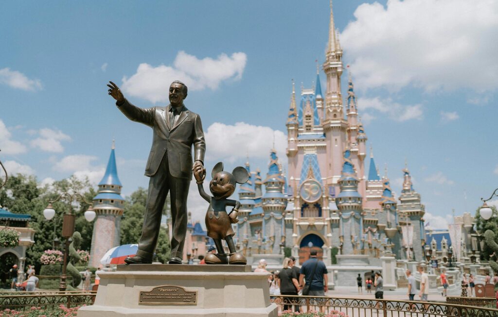 A bronze Walt Disney with Mickey Mouse at Disneyland