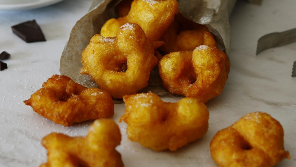 Deep-fried Peruvian Picarones doughnuts get drenched in molasses syrup